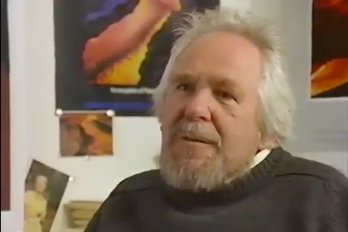 Screenshot of 1995 video of Mike Rhodes of him sitting in office and speaking to camera