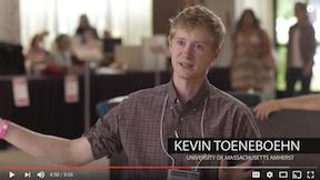 Screen capture of video showing Kevin Toeneboen speaking to camera, making wide gesture with arms.