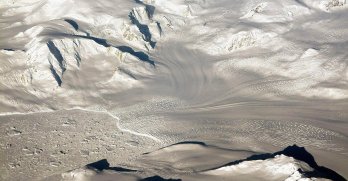 Glaciers and mountains in the evening sun are seen on an Operation IceBridge research flight, returning from West Antarctica. Credit: Sipa US / Alamy Stock Photo