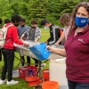 Christine Hatch, UMass extension associate professor in geosciences, talks about the “stream table” during the Climate Change Carnival at Amherst Regional Middle School. Source: Hampshire Gazette STAFF PHOTOS/CAROL LOLLIS