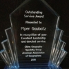 Photograph of crystal award presented to Dr. Gaubatz, with award text etched into crystal