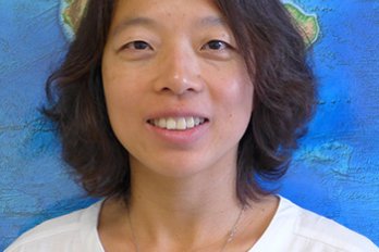 Portrait of Dr. Haiying Gao in front of World Tectonic Map