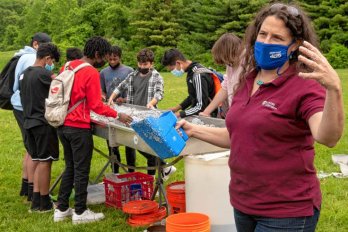 Christine Hatch, UMass extension associate professor in geosciences, talks about the “stream table” during the Climate Change Carnival at Amherst Regional Middle School. Source: Hampshire Gazette STAFF PHOTOS/CAROL LOLLIS