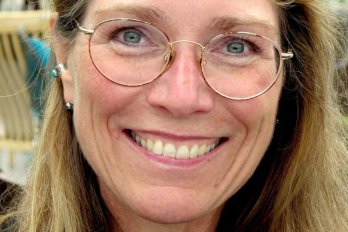 Portrait of Dr. Julie Brigham-Grette, smiling at camera