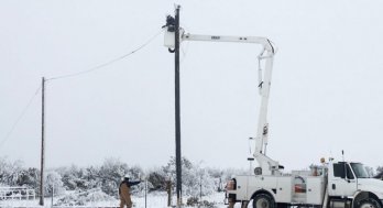 Linemen work to restore power in Texas during winter storm, February 2021. Photo by Jonathan Cutrer, via Flickr [CC BY-NC 2.0] 