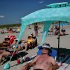 Todd Zuzulo relaxed at the Good Harbor Beach in Gloucester in July.CRAIG F. WALKER/GLOBE STAFF